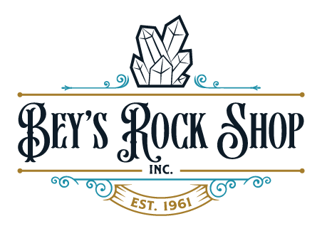 Bey's Rock Shop Inc. logo with a quartz crystal cluster above ornate lettering and an Est. 1961 ribbon, from the official Bey's Rock Shop website.