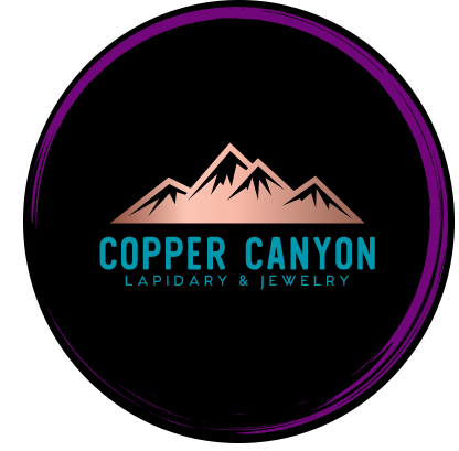 Copper Canyon Lapidary & Jewelry logo, copper-colored mountain peaks above the words Copper Canyon in teal capital letters and Lapidary & Jewelry beneath, inside a black circle with a purple brushstroke border, from the official Copper Canyon Lapidary website.