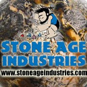 Stone Age Industries logo with a cartoon caveman cutting stone above blue lettering and www.stoneageindustries.com, over a polished stone background, from the company's official Facebook page.